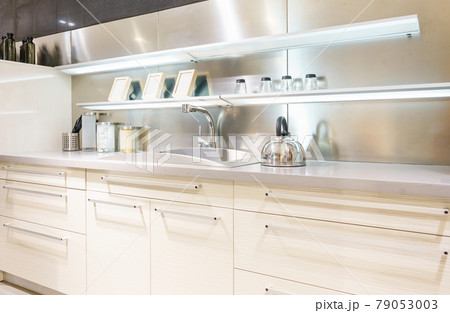 Bright modern kitchen with stainless steel appliances. Interior design. Bright modern kitchen with stainless steel appliances. Interior design. 79053003