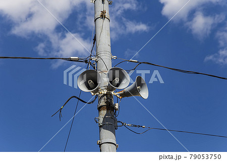 Megaphone speaker (reproducer) on the pole lighting against the sky with clouds. Moscow, Russia Megaphone speaker (reproducer) on the pole lighting against the sky with clouds. Moscow, Russia 79053750