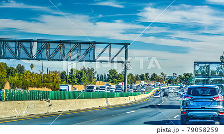Cars on the freeway on a cloudy day 79058259