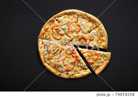 Pizza with ham pepper and cheese on a black stone background 79059208