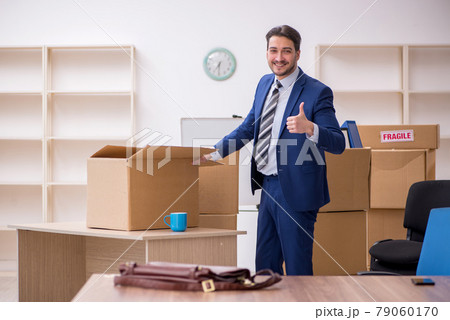 Young male employee in relocation concept 79060170