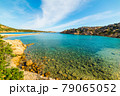 Clear water in La Maddalena shore 79065052