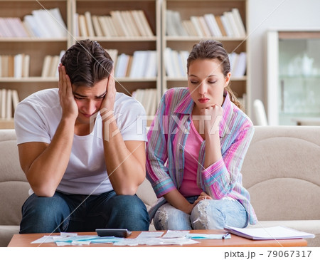 Young family discussing family finances Young family discussing family finances 79067317