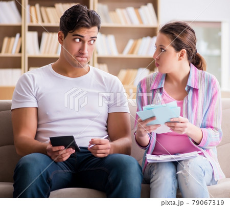 Young family discussing family finances Young family discussing family finances 79067319
