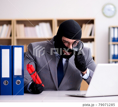 Criminal businessman with dynamite in the office 79071285
