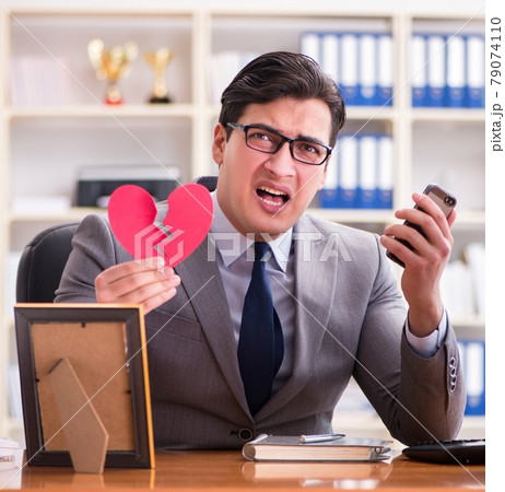 Businessman in saint valentine concept in office Businessman in saint valentine concept in office 79074110