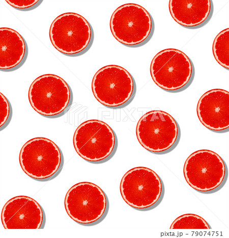 Seamless grapefruit with shade pattern on white surface. Colorful fresh citrus slice pattern. 79074751