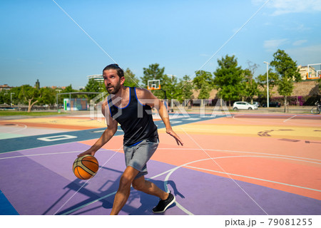 basketball player runs on a basketball court with a ball 79081255