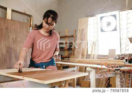 Carpenter Varnishing Wooden Board Carpenter Varnishing Wooden Board 79087858