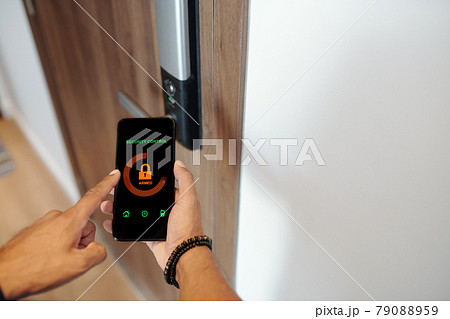Man Using Smart Lock Applicaition Man Using Smart Lock Applicaition 79088959