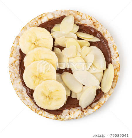 Rice cakes with chocolate paste and banana Rice cakes with chocolate paste and banana 79089041