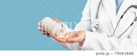 Female doctor pointing at pills. Medicine and pharmacy 79093886