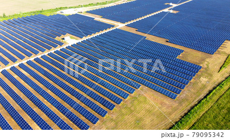 Aerial drone view flight over solar power station panels. Aerial drone view flight over solar power station panels. 79095342