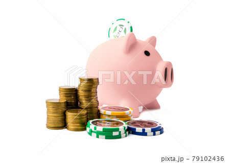 Piggy bank and money coins stack with casino chips on white background. Concept of gambling savings. 79102436