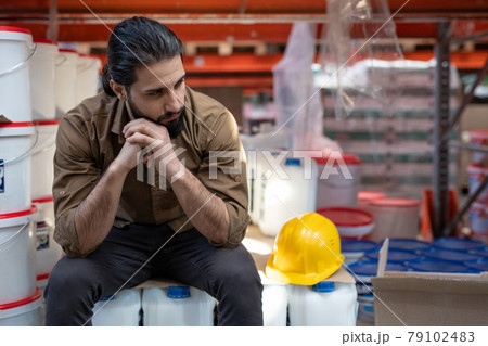 Young tired male worker having rest 79102483