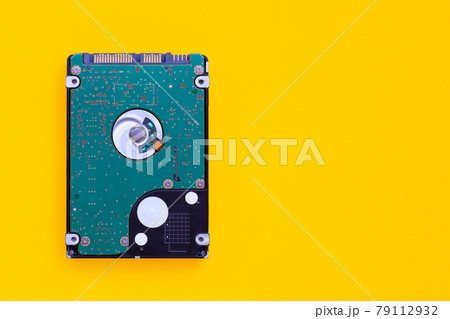 Hard disk drive of computer on yellow background. Hard disk drive of computer on yellow background. 79112932