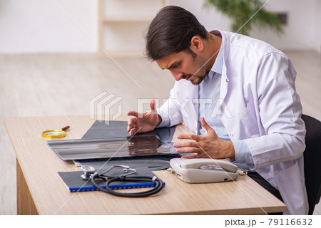 Young male doctor radiologist working in the clinic 79116632