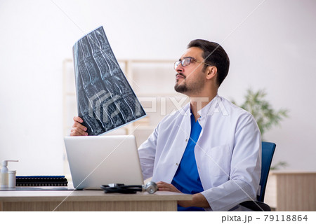 Young male doctor radiologist working in the clinic Young male doctor radiologist working in the clinic 79118864