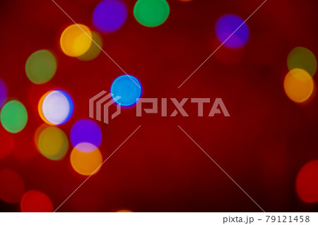 Defocus multicolored lights. Red bokeh background. Abstract christmas texture 79121458