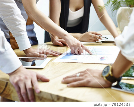 group of business people meeting in office discussing and reviewing sales performance 79124532