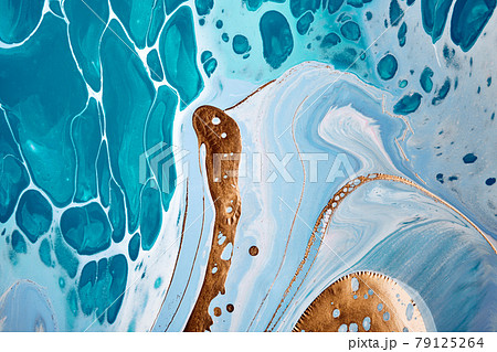 Acrylic Fluid Art. Liquid gold on blue waves and spots. Abstract marble background or texture 79125264