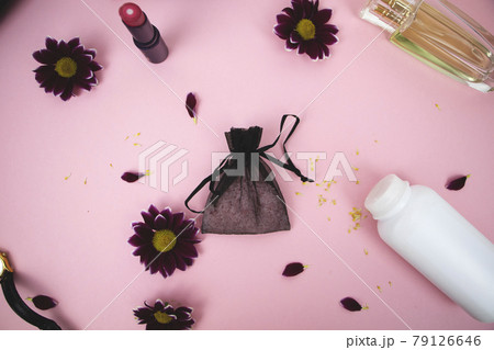 Cosmetics on the table at the woman. Cosmetic bag, cosmetic and hygiene products. Pink background for text Cosmetics on the table at the woman. Cosmetic bag, cosmetic and hygiene products. Pink background for text 79126646