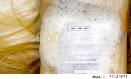 Sodium laureth sulfate (SLES). Composition of shampoo with sulfate on woman's hair 79129373