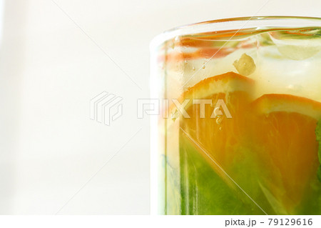 Citrus lemonade on white wooden background close up 79129616