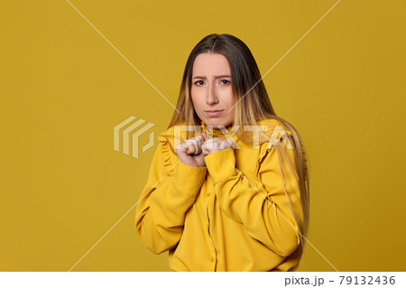 scared blonde woman on yellow background. Human emotions scared blonde woman on yellow background. Human emotions 79132436