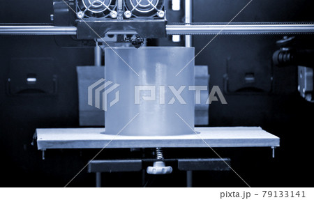 3D printer prints the form of molten plastic blue gray close-up. 3D printer prints the form of molten plastic blue gray close-up. 79133141