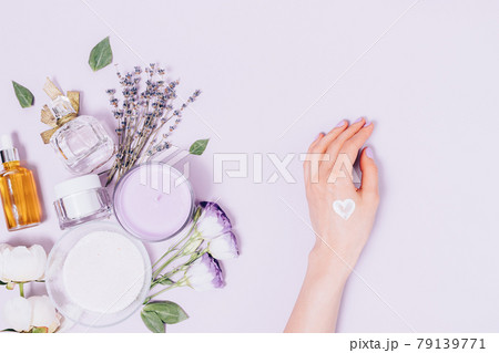 Skin care concept, female hand with applied heart-shaped sample cream Skin care concept, female hand with applied heart-shaped sample cream 79139771