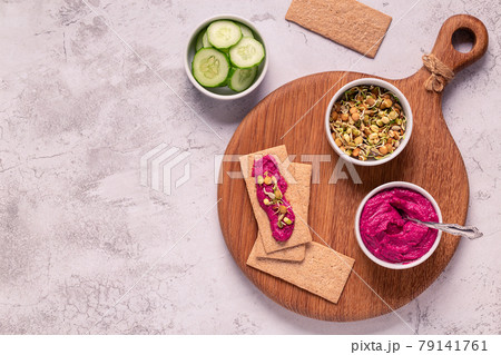 beetroot hummus, sprouted grains, cucumber, and whole grain crisps 79141761