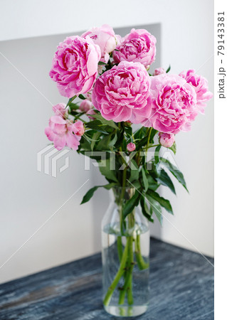 Flower bouquet of pink natural peonies flowers in a vase 79143381