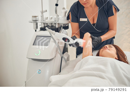 Young woman getting relifting treatment in salon Young woman getting relifting treatment in salon 79149291