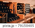 Glass bottles of wine in wooden crates 79150405