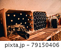Storage room with wine bottles in wooden crates 79150406