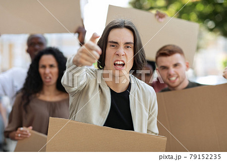 Angry guy leading multiracial group of protestors Angry guy leading multiracial group of protestors 79152235
