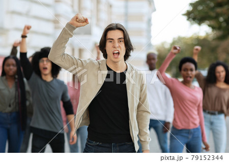 Activists chanting slogans, making strike on the street 79152344