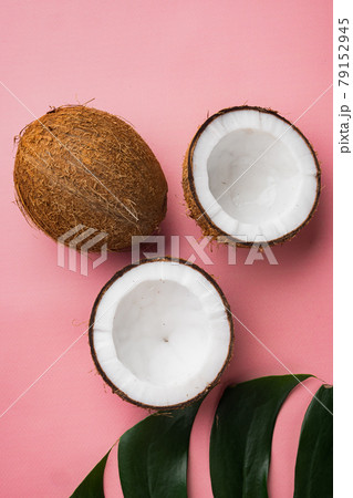 Coconut slices, on pink textured summer background, top view flat lay 79152945