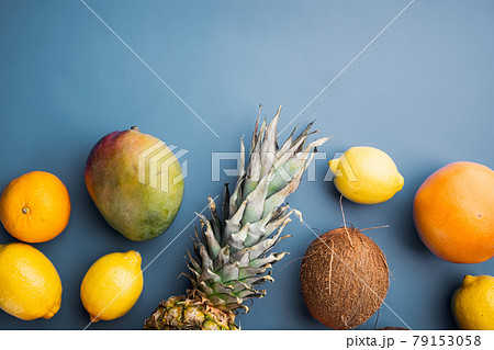 Mix of different fruits, on blue textured summer background, top view flat lay, with copy space for text Mix of different fruits, on blue textured summer background, top view flat lay, with copy space for text 79153058