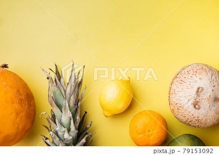 Assortment of different fruits, on yellow textured summer background, top view flat lay, with copy space for text 79153092