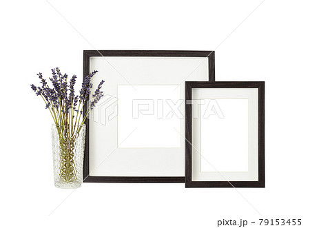 Dark brown wooden frames with bouquet of dry lavander isolated on white background Dark brown wooden frames with bouquet of dry lavander isolated on white background 79153455