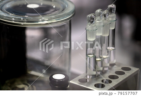glass test tubes and jars in the lab. concept of medicine and science glass test tubes and jars in the lab. concept of medicine and science 79157707