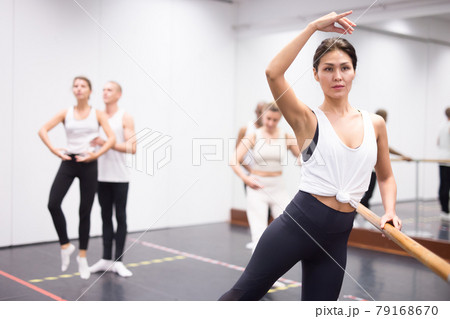 Woman practicing ballet elements in class 79168670