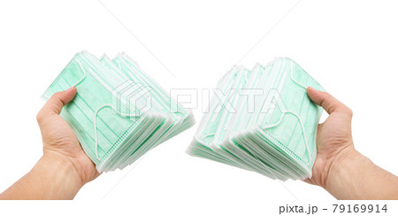 Germ protection mask in the hand on a white background 79169914