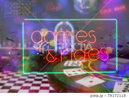 Neon Rainy Window Blur Image, Games and Rides Sign Neon Rainy Window Blur Image, Games and Rides Sign 79172118