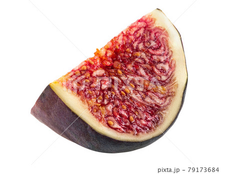 Slice of a purple fig isolated on white background with copy space. Soft, sweet fruit, skin is thin, red flesh has many seeds inside of it. Close-up. 79173684