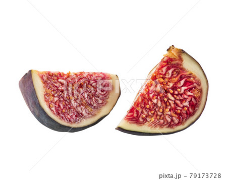 Two slices of purple fig isolated on white background with copy space. Soft, sweet fruit, skin is thin, red flesh has many seeds. Close-up. Two slices of purple fig isolated on white background with copy space. Soft, sweet fruit, skin is thin, red flesh has many seeds. Close-up. 79173728