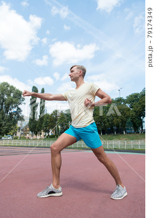 workout of man punching sunny outdoor 79174349