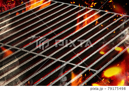 Hot empty portable summer barbecue BBQ grill with bright flaming fire and ember charcoal. Cookout concept. Close up 79175498